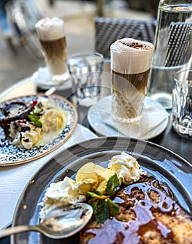 Coffee with ice cream and whipped cream on the table in Paris, France.