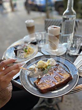 Coffee with ice cream and whipped cream on the table in Paris, France.