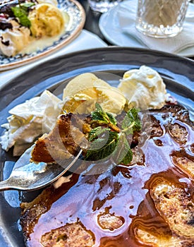 Coffee with ice cream and whipped cream on the table in Paris, France.