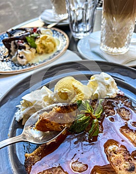 Coffee with ice cream and whipped cream on the table in Paris, France.