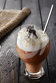 Coffee ice cream on wooden table