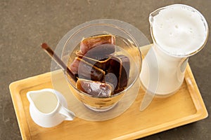 Coffee in ice cube shape with steam milk and syrup