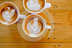 Coffee latte art on wood table tree