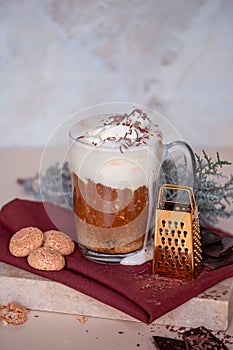 Coffee latte, cookies and cade branch in Christmas mood. Grater for chocolate