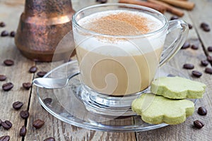 Coffee latte in glass cups with matcha cookies