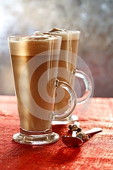 Coffee Latte on glitter backdrop with sunny light