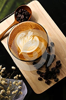 Coffee Latte Milk cream flower Wooden spoon coffee bean Background Wood