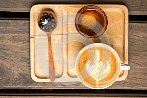 Coffee Latte Milk cream flower Wooden spoon coffee bean Background Wood