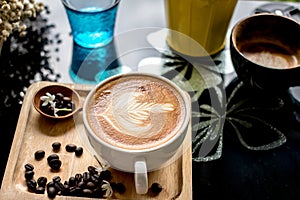 Coffee Latte Milk cream flower Wooden spoon coffee bean Background Wood