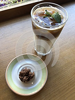 Coffee latte with mint and chocolate candy