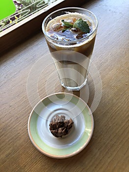 Coffee latte with mint and chocolate candy