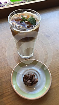 Coffee latte with mint and chocolate candy