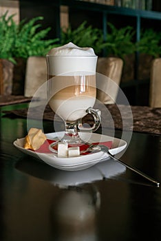 Coffee Latte in Transparent Glass silver in Cafe, Latte Macchiato photo