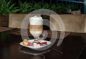 Coffee Latte in Transparent Glass silver in Cafe, Latte Macchiato photo