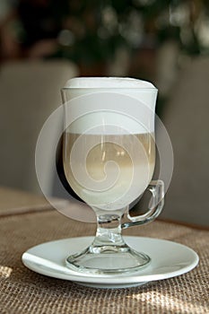 Coffee Latte in Transparent Glass silver in Cafe, Latte Macchiat photo