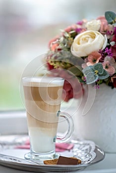 Coffee Latte in Transparent Glass silver in Cafe, Latte Macchiat photo