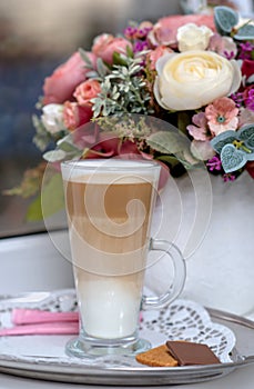 Coffee Latte in Transparent Glass silver in Cafe, Latte Macchiat photo