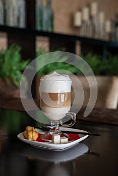 Coffee Latte in Transparent Glass silver in Cafe photo