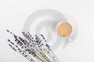 Coffee and lavender flower on white table from above. Woman working desk. Cozy breakfast. Mockup. Flat lay style.