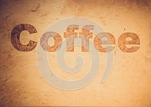 coffee lettering on wood background