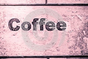 coffee lettering on wood background