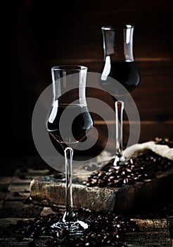 Coffee liqueur, vintage wooden background, selective focus