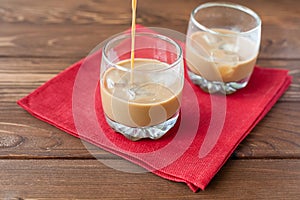 Coffee liqueury pouring into glass