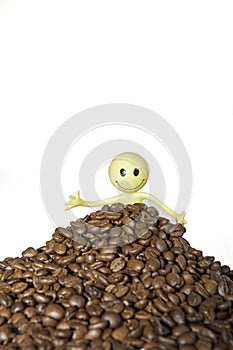 Coffee lover buried in a hlll of organic coffee beans