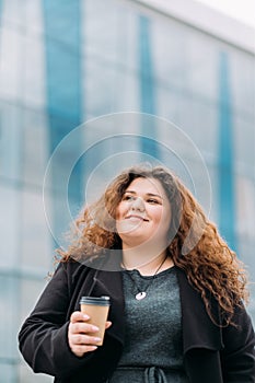 coffee lover pleased curvy woman enjoying moment