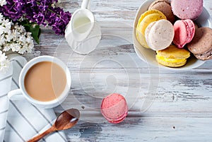 Coffee and macaruns on a white background