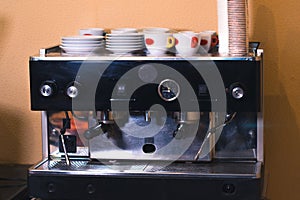 Coffee machine in coffee on a blurred background.