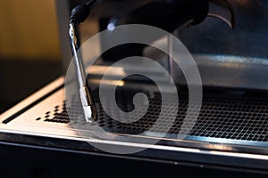 Coffee machine in coffee on a blurred background.