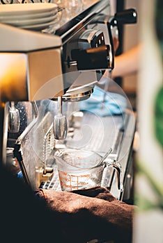 Coffee machine in coffee shop, barista cafe making coffee