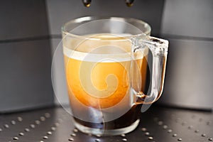 Coffee Machine Cup of fresh coffee closeup