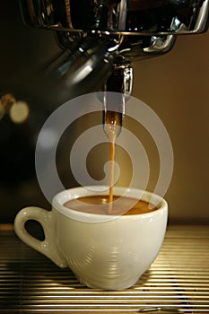 Coffee machine filling cup photo