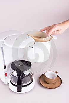 Coffee machine with filter bag and cup