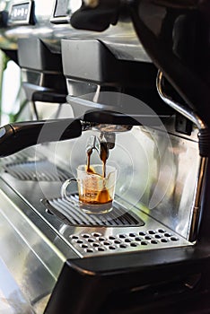 coffee machine making espresso in a cup close up