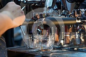 Coffee machine making espresso shot in a cafe shop