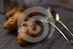 coffee maker and croissants on wooden table