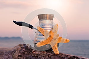 Coffee maker with freshly brewed coffee and starfish