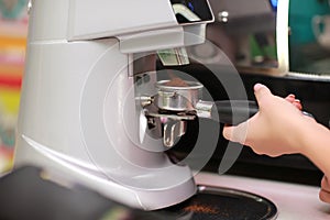 Coffee maker machine. Barista girl prepares coffee on the coffee machine