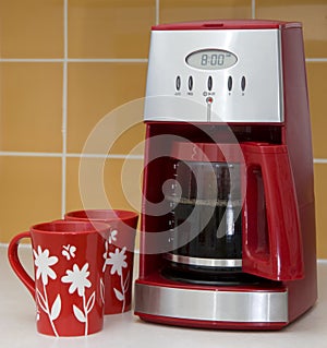 Coffee maker and mugs photo