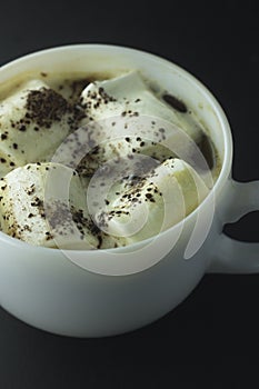 Coffee with marshmallow on a black background