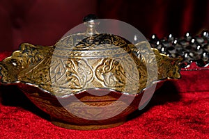 Coffee in metal Turkish traditional cup, being served in a traditional cafe bar in Istanbul, Turkey