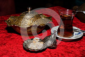 Coffee in metal Turkish traditional cup, being served in a traditional cafe bar in Istanbul, Turkey