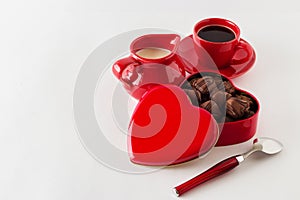 Coffee with milk, chocolate candy. on white background.