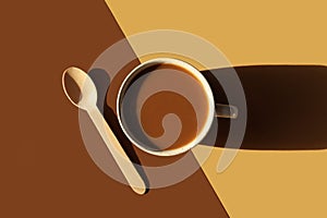 Coffee with milk concept. Cup of morning drink, wooden teaspoon on double diagonal background. Monochrome horizontal banner,