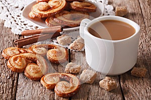 Coffee with milk and cookies Palmiers close-up. horizontal photo