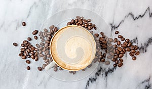 Coffee milk in a cup on marble table.