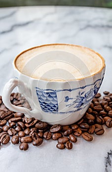 Coffee milk in a cup on marble table.